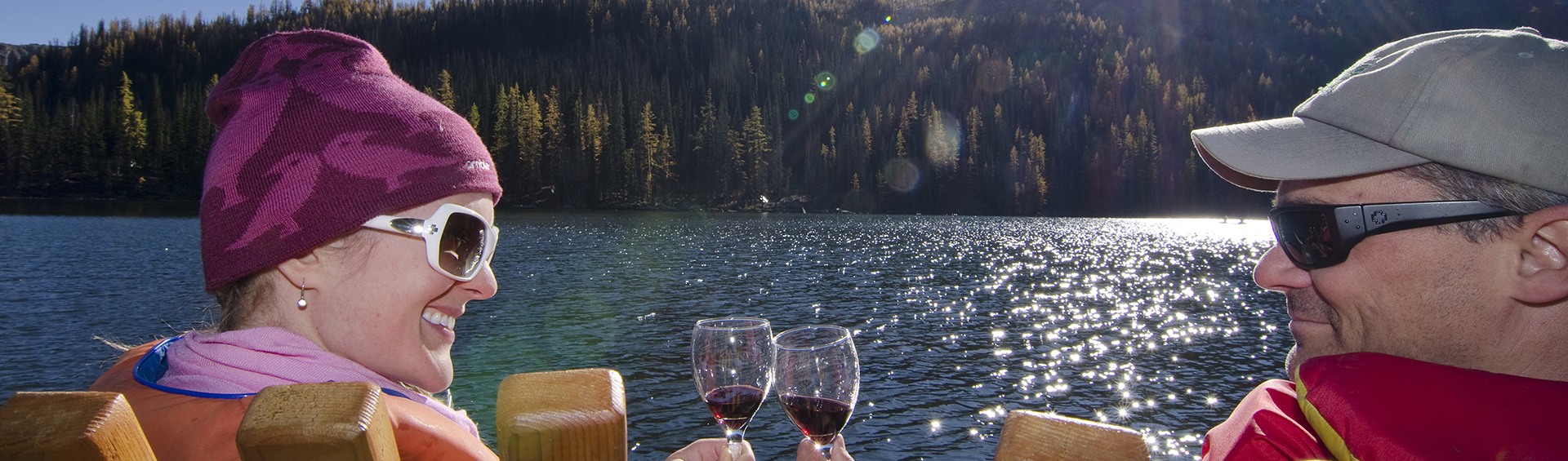 Glass of wine by the lake
