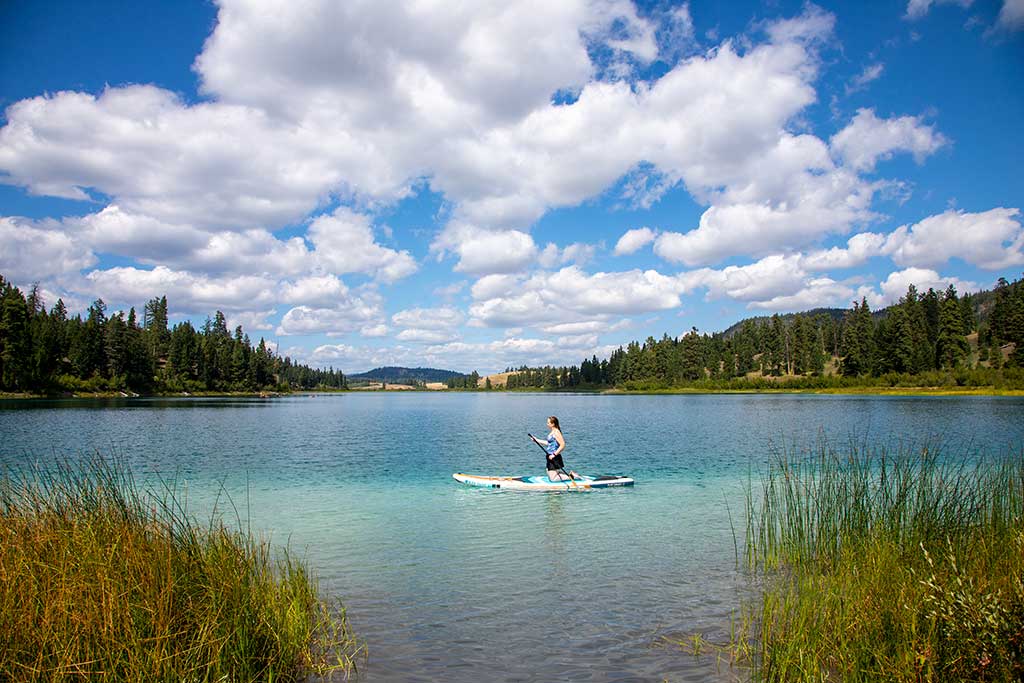 Paddle boarding on turquoise lake