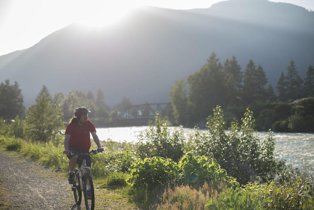 Cycling on path beside river in Hope